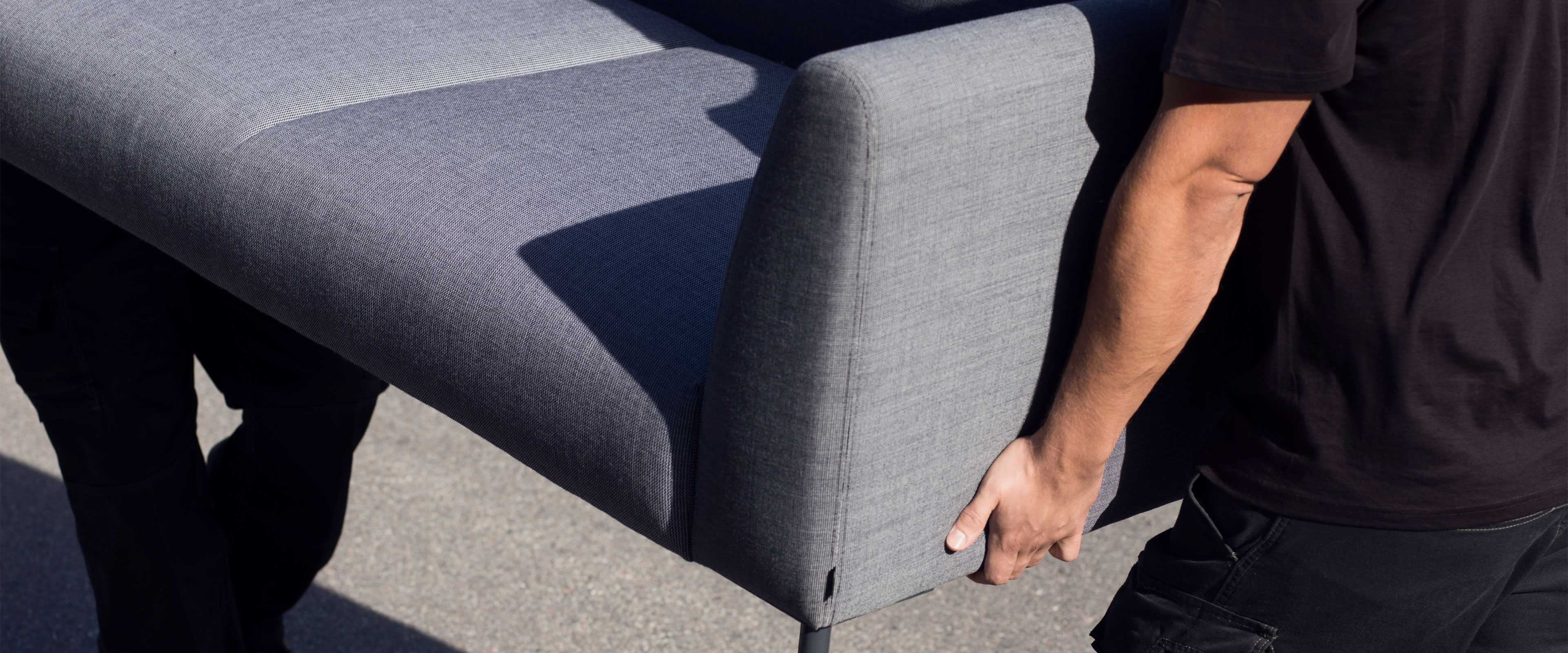 Movers delivering Martela's Nooa sofa